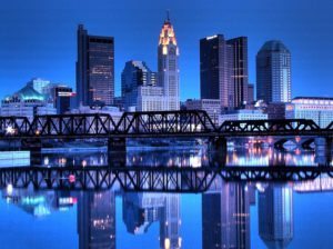 The skyline of downtown Columbus, Ohio reflected in the Scioto River.