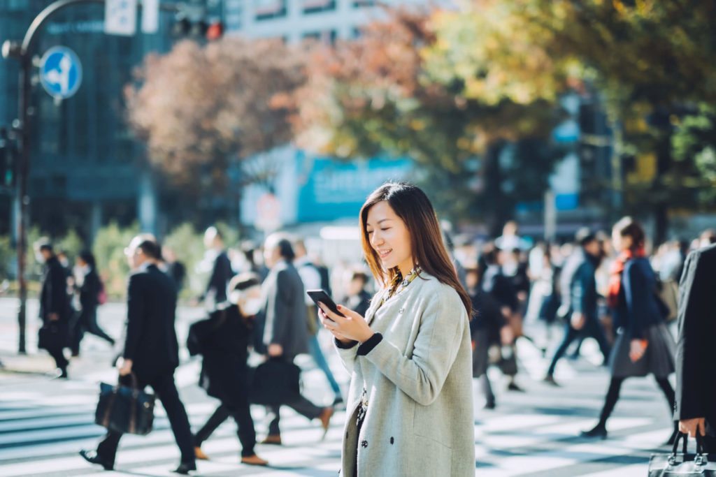 Woman on cell phone in city