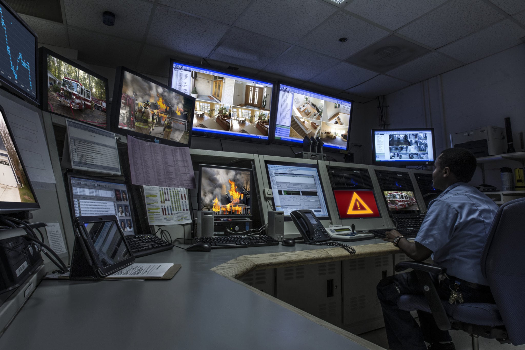 Security officer watches monitors