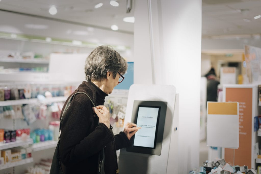 woman accesses tablet in retail location