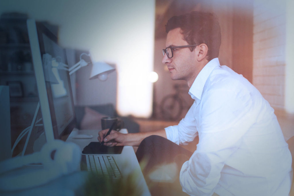 Man on computer filling cyber insurance questionnaire