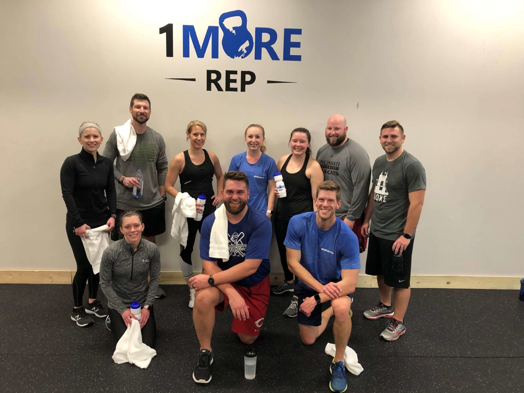 Fitfluence members taking a group photo at 1MoreRep gym