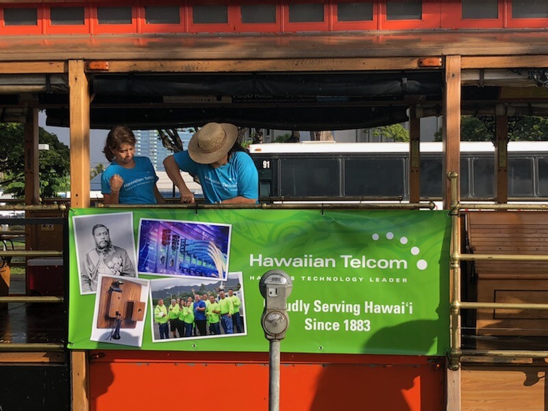 Polynesian Connection members hanging banner