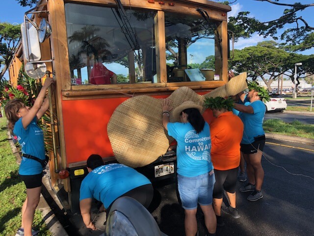 Polynesian Connection members decorating trolly