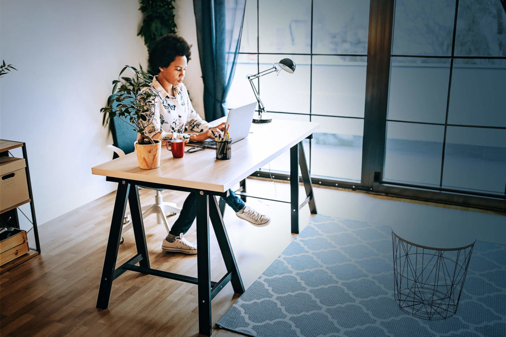 woman at computer working on phishing simulation