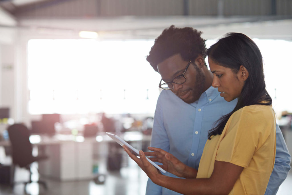 Man and woman looking at tablet