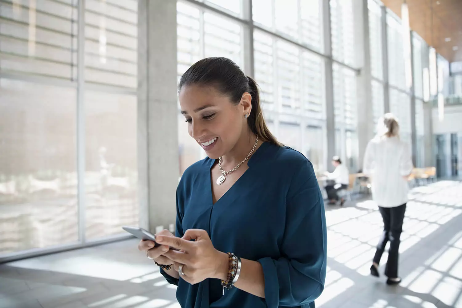 Woman indoors on cell phone